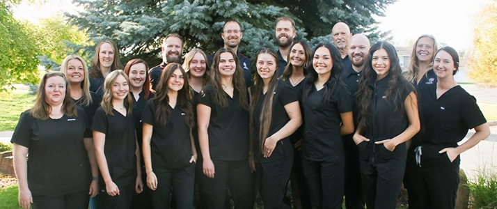 Chiropractor Brian Tolman Posed With The Whole Live Well Chiropractic Team Outside